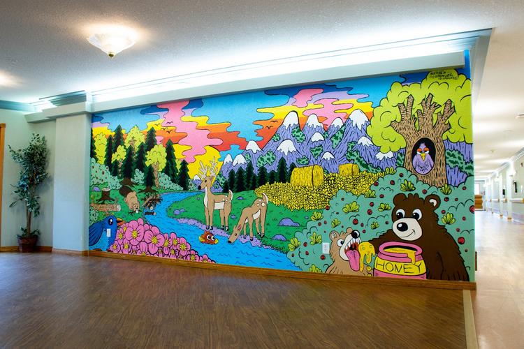 <p>Wentworth Manor's vibrant, woodlands-inspired mural was made possible thanks to funding support from the Calgary Foundation’s Neighbourhood Grants Program.</p>
